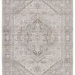 Traditional rug with ornate center medallion in taupe, silver, and cream hues, featuring vintage-inspired patterns