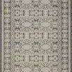 Ivory indoor/outdoor rug with intricate geometric and floral patterns in neutral tones, framed by decorative border