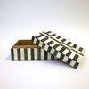 Open box angled with lid resting partially on side, showing plain light brown interior