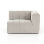 Zoomed detail of seat cushion showing broad vertical channel tufting in light sandstone fabric