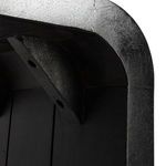 Close-up view under table corner showing internal support braces and wood grain texture