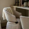 Brewer chair styled in cozy room with striped throw draped over backrest