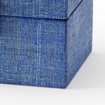 Close-up side view showing blue raffia weave texture on box corner