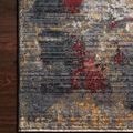 Samra dark grey rug with spice red and muted gold abstract patterns on polypropylene pile with fringed edge