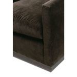 Low-angle close-up of bottom right corner showing dark fabric and wooden swivel base