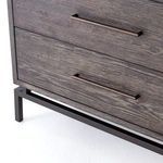 Handle close-up depicting linear iron pulls integrated with textured grey oak drawer fronts