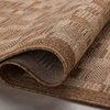 Partially rolled rug showing texture and thickness of the polypropylene weave