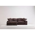 sectional flipped chaise on left side shown in bright studio setting with white rug