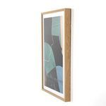 Alternate side angle of the framed mixed media artwork showing frame thickness and wall clearance
