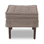 Front view highlighting tufted top cushion and fabric skirt with side handles on Cole Ottoman