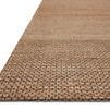 Side-angle view showing rug’s flat weave and slightly raised edge on a white background