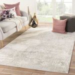 Brixt rug styled in a modern living room with sofa, pillows, and natural light
