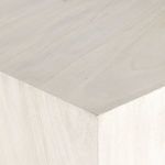 Close-up of smooth wood edge and corner on console table surface
