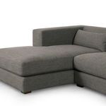 Close-up of chaise seat cushion and corner, showing plush upholstery detail