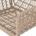 Close-up of woven white wicker armrest detailing and texture