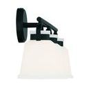 Kaden bath light viewed from side focusing on the circular wall mount and layered lamp shades