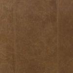 Close-up of natural sand-colored top-grain leather texture with visible fine stitches.