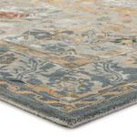 Close-up angled view showing plush pile and detailed border pattern of the multicolor Cristobol rug
