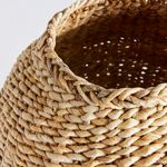 Close-up on the basket weave pattern and twisted rim detail of the abaca teardrop vase
