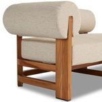 Angled view of backrest attachment to teak frame with tightly stretched fabric