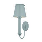 Yara Wall Sconce in soft blue with candle sleeve, curved arm, round backplate, and tapered metal shade