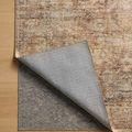 Rug corner folded to reveal underside backing and texture