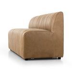 Side angle view emphasizing the banquette’s plush channeling and firm cushion edges