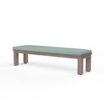 Laguna Dining Bench with hand-brushed driftwood finish and tailored light blue cushion on a rectangular aluminum frame