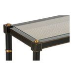 Close-up of Conner Cane Console corner with black frame, gold hand-painted accents, and caned shelf under glass