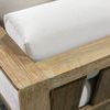 Close-up of chair corner showing texture and grain of teak wood with light beige cushion fabric