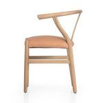 Side profile highlighting slender ash frame and cantilevered leather seat cushion