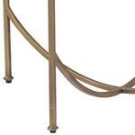Lower iron frame detail showing curved braces near the table legs and rubber feet