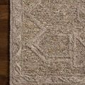 Close-up of rug corner showing detailed texture and pattern on wooden floor