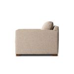 Side profile of chair showing thickness of cushions and armrest