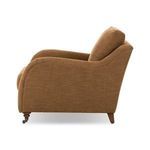 Side view of Lynne chair showing smooth curve of armrest and back profile