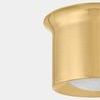 Close-up angled view of Noxon flush mount showing polished brass metal texture and cloud glass surface