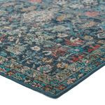 Close-up corner view showing texture and edge stitching of the Lisana dark blue multicolor rug