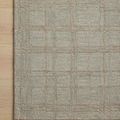 Corner close-up of Polly Fog Wheat Rug showing detailed grid pattern and texture on light wood flooring