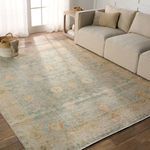 Lovato rug styled in living room with neutral sofa, natural light, and wooden flooring