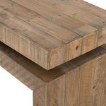 Close-up showing layered wood top with weathered grain and character marks