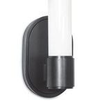 Side angle of Dixon Single Sconce highlighting the cylindrical glass and rounded dark metal base