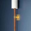 Minnetonka Wall Sconce with rectangular mahogany arm wrapped in rattan, Aged Brass backplate, and white linen shade