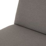 Close crop of smooth charcoal cushion fabric on corner of seat