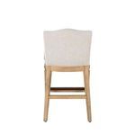 Rear view of Gaston stool showing upholstered back and wood frame crossbars