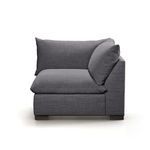 Side profile with armrest on right side and plush cushions in smooth charcoal fabric
