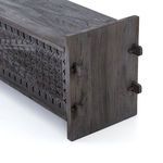 Close-up of trunk's smooth wood top and side panel showing natural grain and pegged joints
