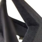 Close-up of Tiago Sculpture’s textured porcelain surface and angular corner joint