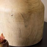 Close-up of lamp base in room setting highlighting knots and grain patterns in eucalyptus wood