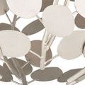 Detailed view of clustered round silver metal discs connected by short metal stems