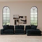 Three-piece sectional configuration of Plunge sofas in dark blue corduroy shown in a bright living room